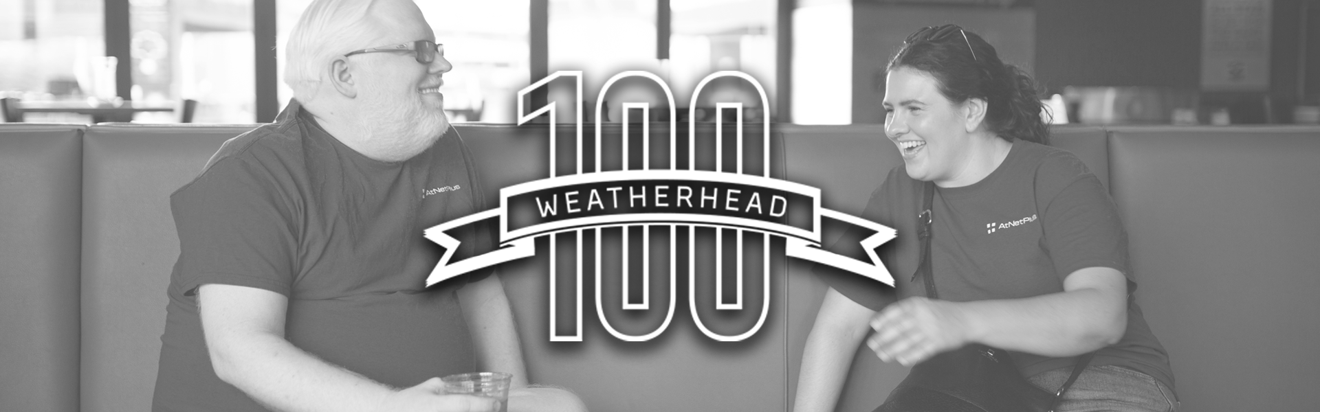 weatherhead 100 logo with background of two AtNetPlus Team members, symbolizing their achievement in securing a place in the prestigious Weatherhead 100