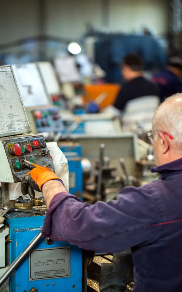 Manufacturing employee working in plant with Manufacturing IT services